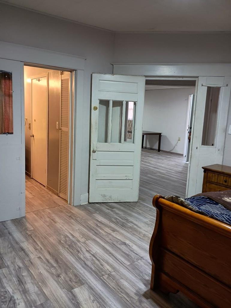 302 South 3rd Street Lamar, CO 81052 - Photo 11 of 12 a living room with furniture and wooden floor