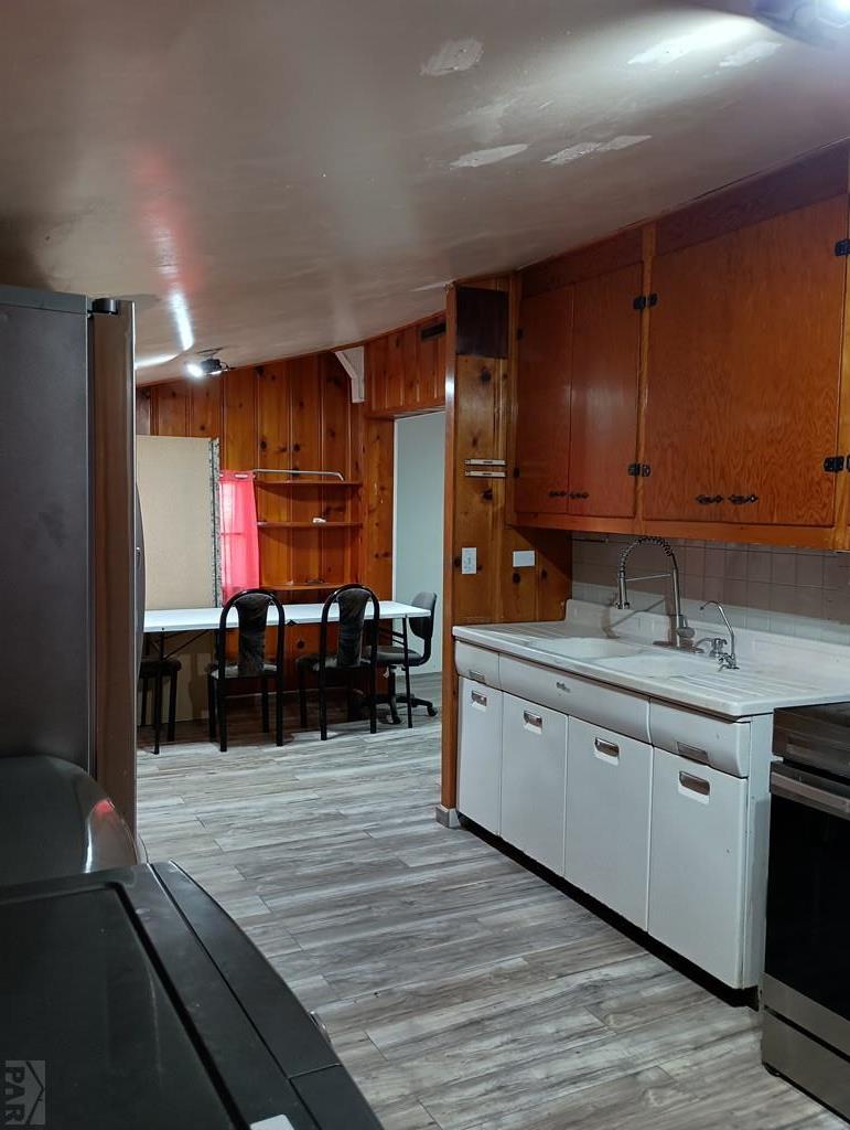 302 South 3rd Street Lamar, CO 81052 - Photo 3 of 12 a kitchen with stainless steel appliances granite countertop a sink counter space and cabinets
