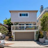 a front view of a house with parking