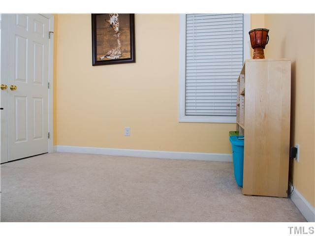 828 Cedar Downs Drive Raleigh, NC 27607 - Photo 11 of 16 a view of an empty room with a window