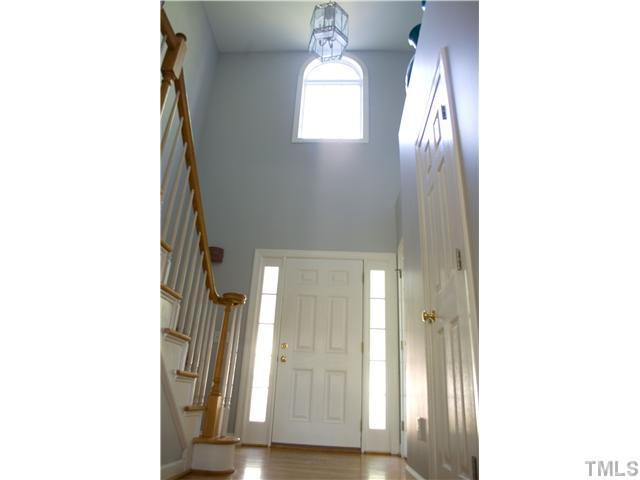 828 Cedar Downs Drive Raleigh, NC 27607 - Photo 2 of 16 a view of a room that has a window and wooden floor