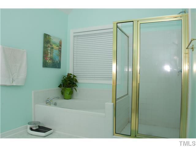 828 Cedar Downs Drive Raleigh, NC 27607 - Photo 10 of 16 a bathroom with a bathtub