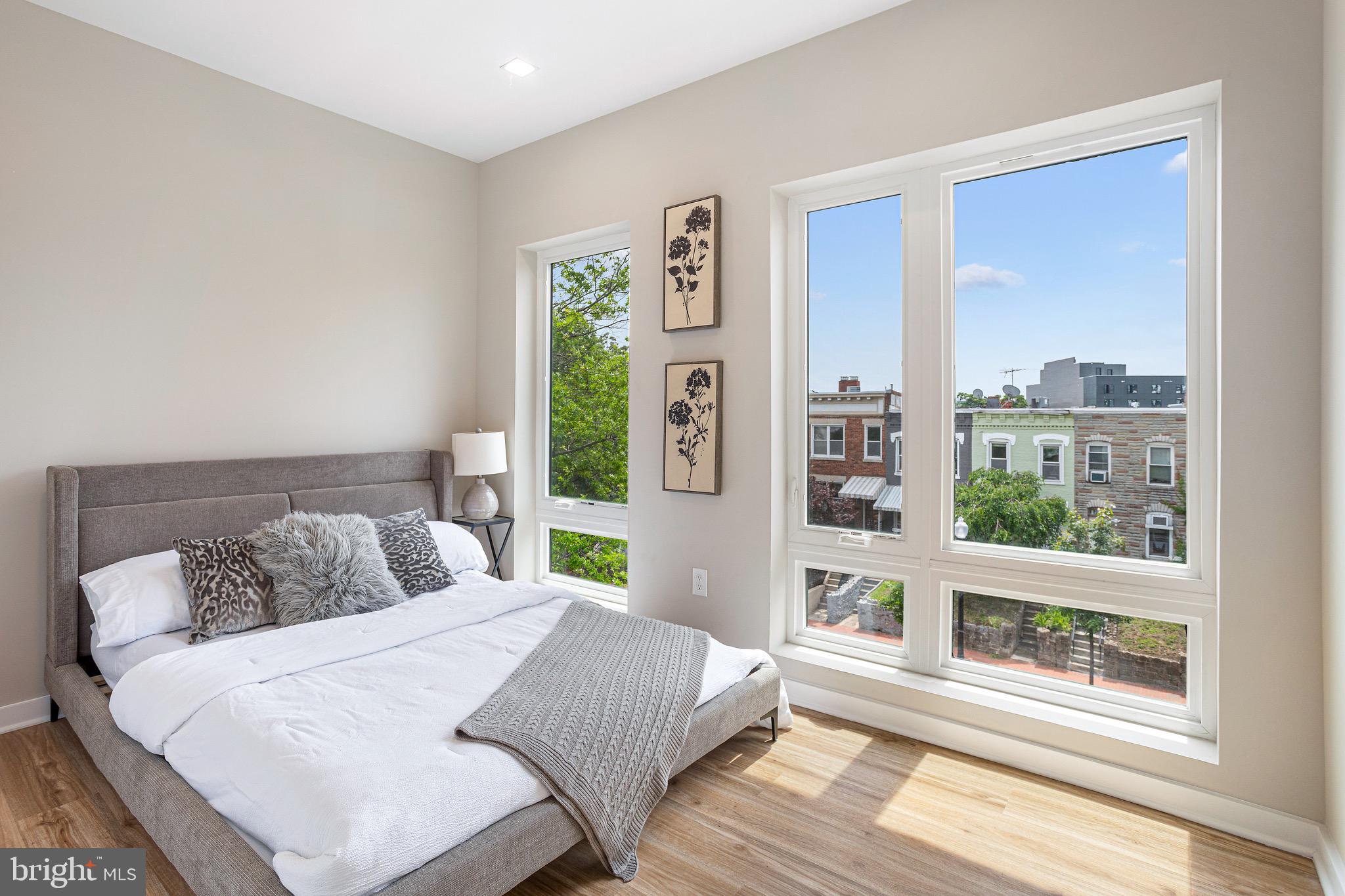 1358 Florida Avenue Northeast, Unit 402 Washington, DC 20002 - Photo 12 of 19 a bedroom with a large window and a bed
