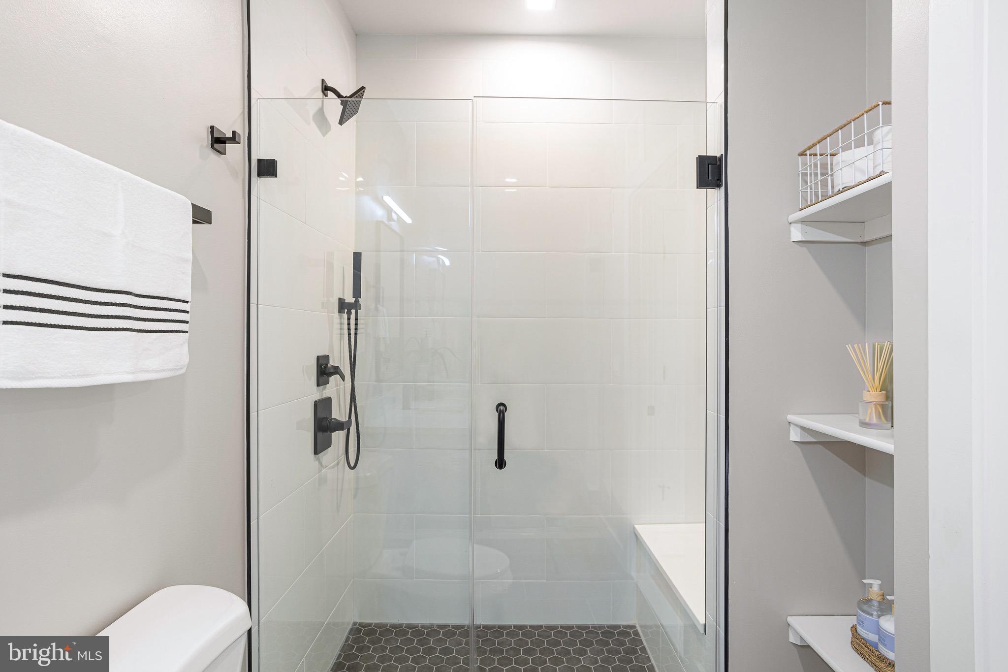 1358 Florida Avenue Northeast, Unit 402 Washington, DC 20002 - Photo 8 of 19 a bathroom with a shower and toilet