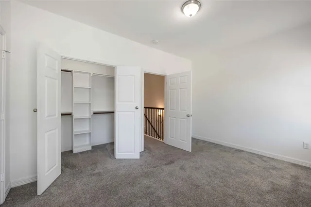 a view of an empty room and fire place