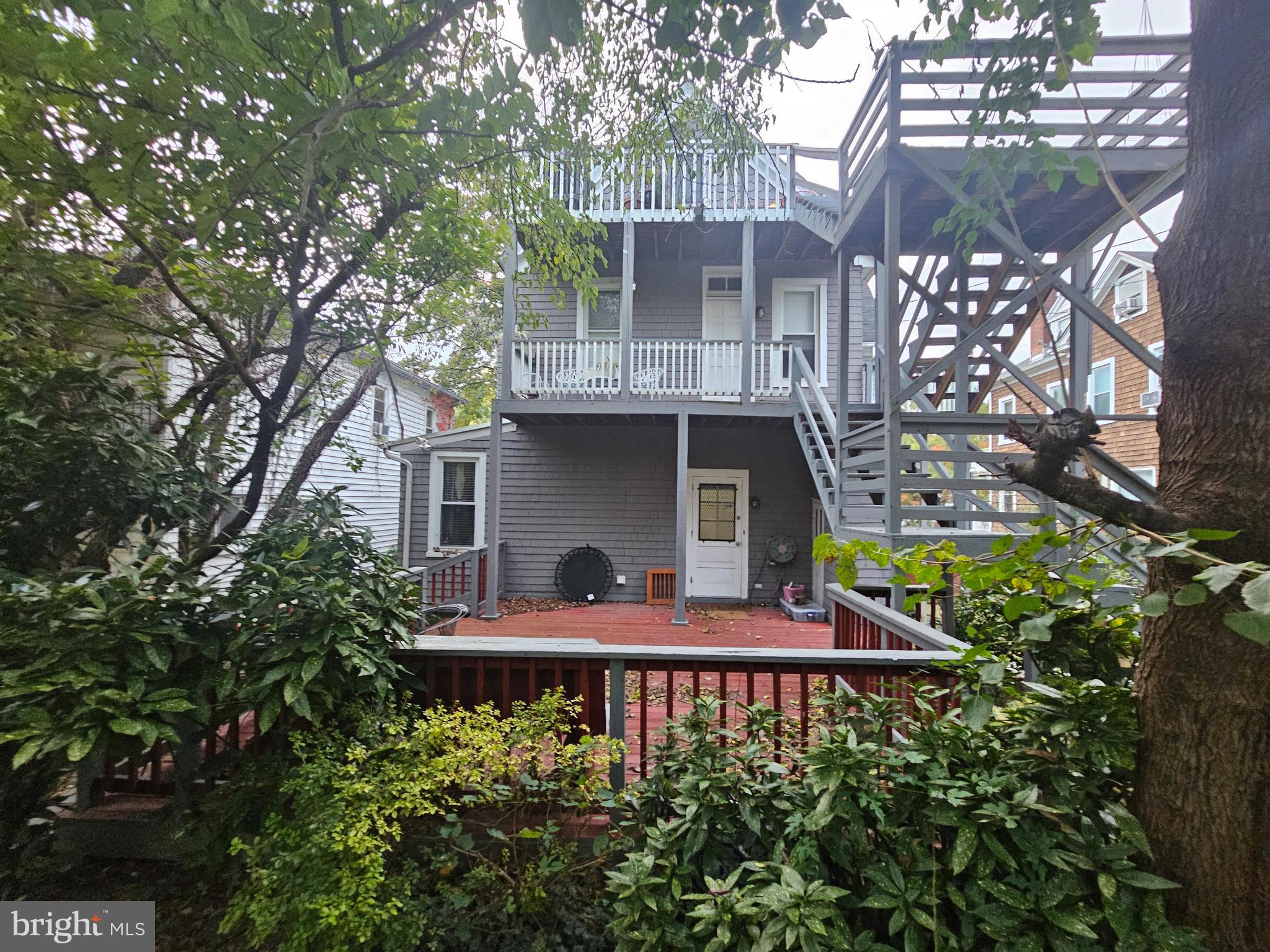 5017 Roland Avenue Baltimore, MD 21210 - Photo 30 of 35 a front view of house with yard and trees around