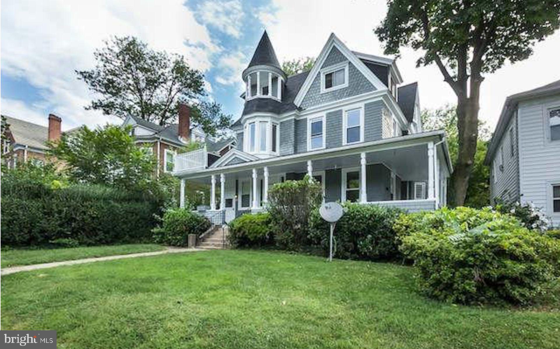 5017 Roland Avenue Baltimore, MD 21210 - Photo 3 of 35 a front view of a house with garden