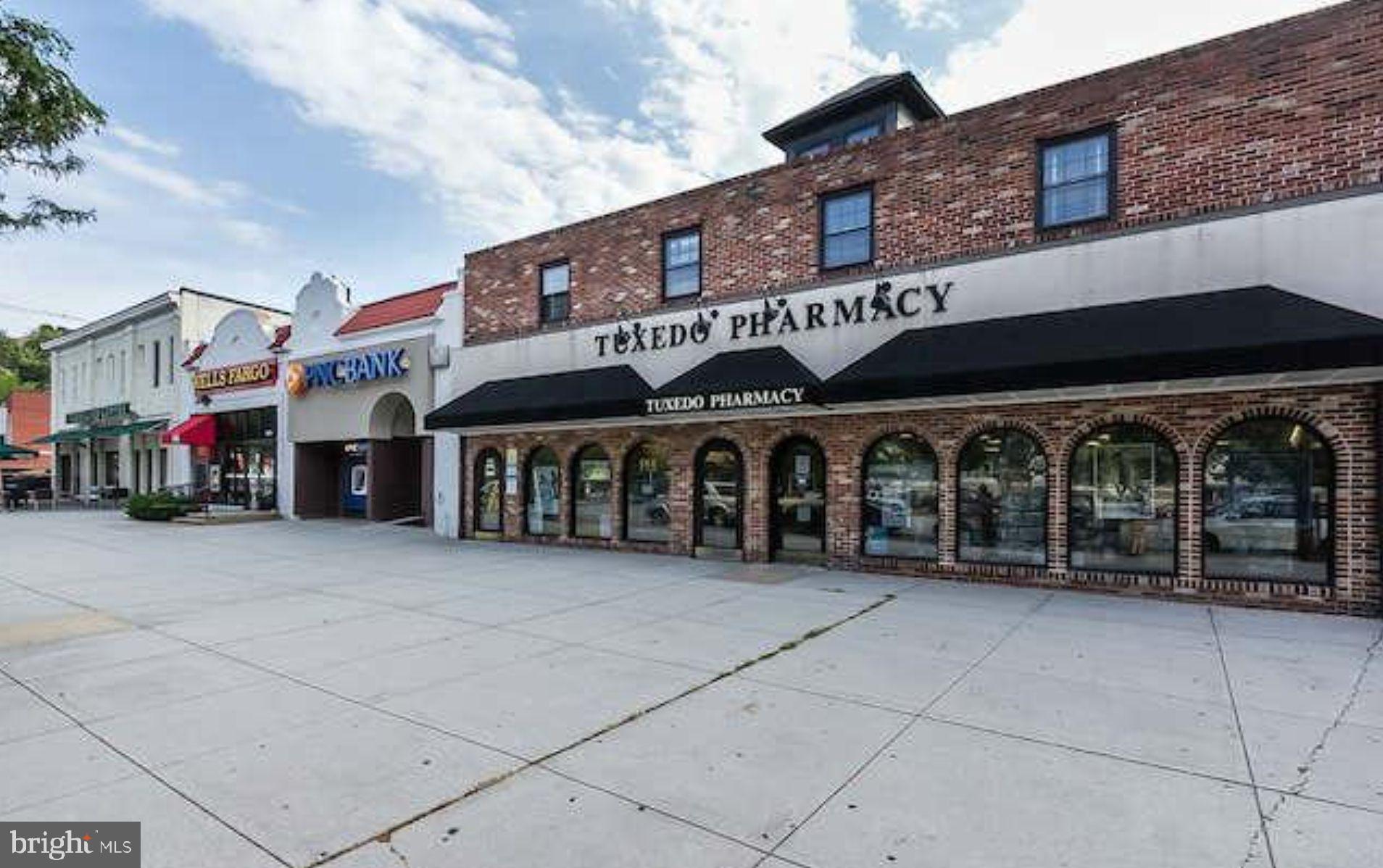 5017 Roland Avenue Baltimore, MD 21210 - Photo 34 of 35 a front view of a building with retail shops