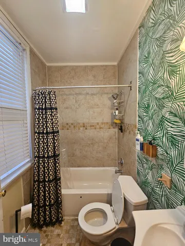 a bathroom with a bath tub