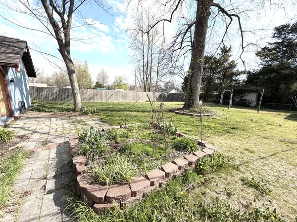 a view of backyard with large window