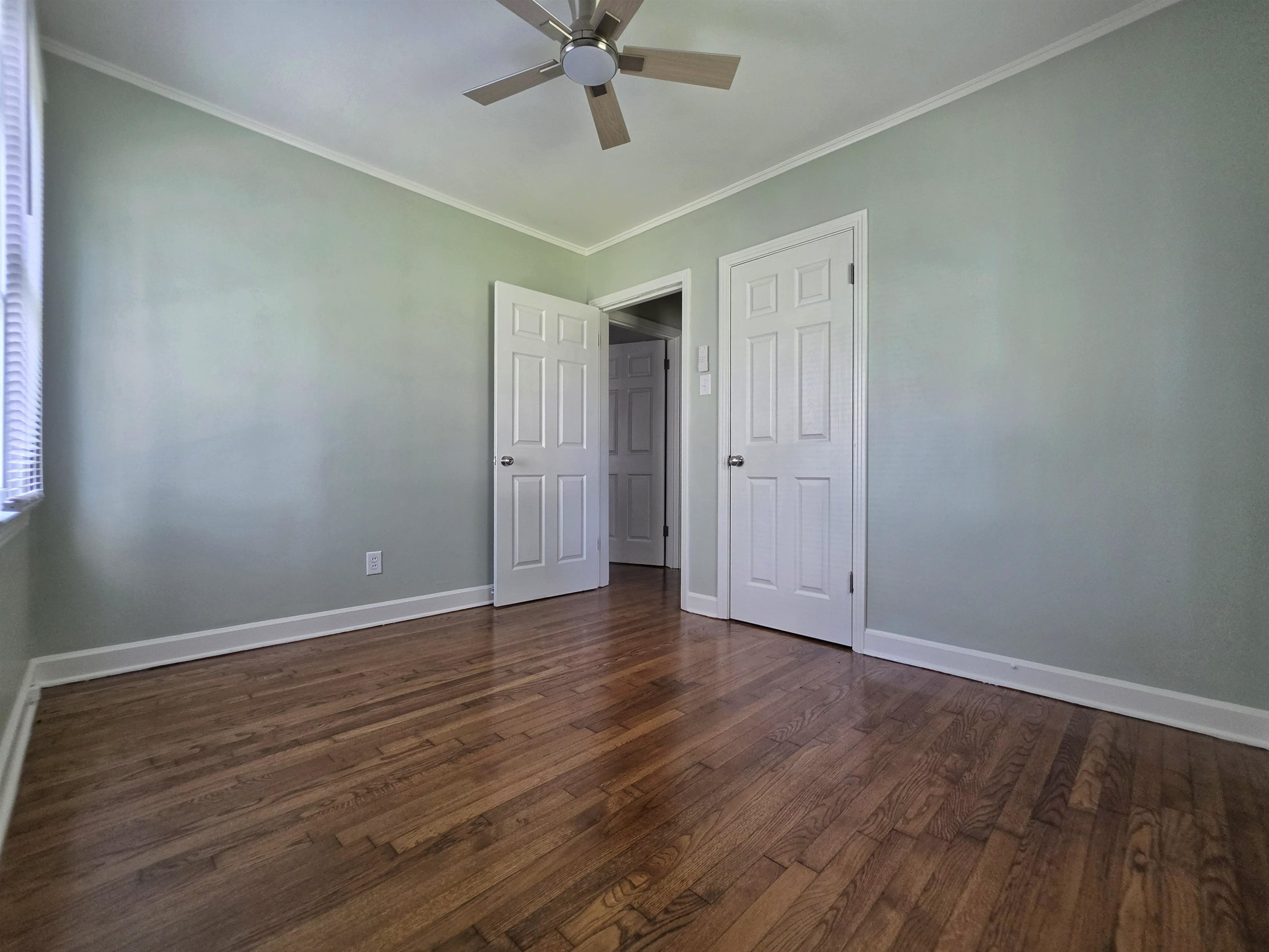 7966 Martha Road Millington, TN 38053 - Photo 14 of 26 Room featuring wood-finish flooring, light-toned wall paint, and white trim