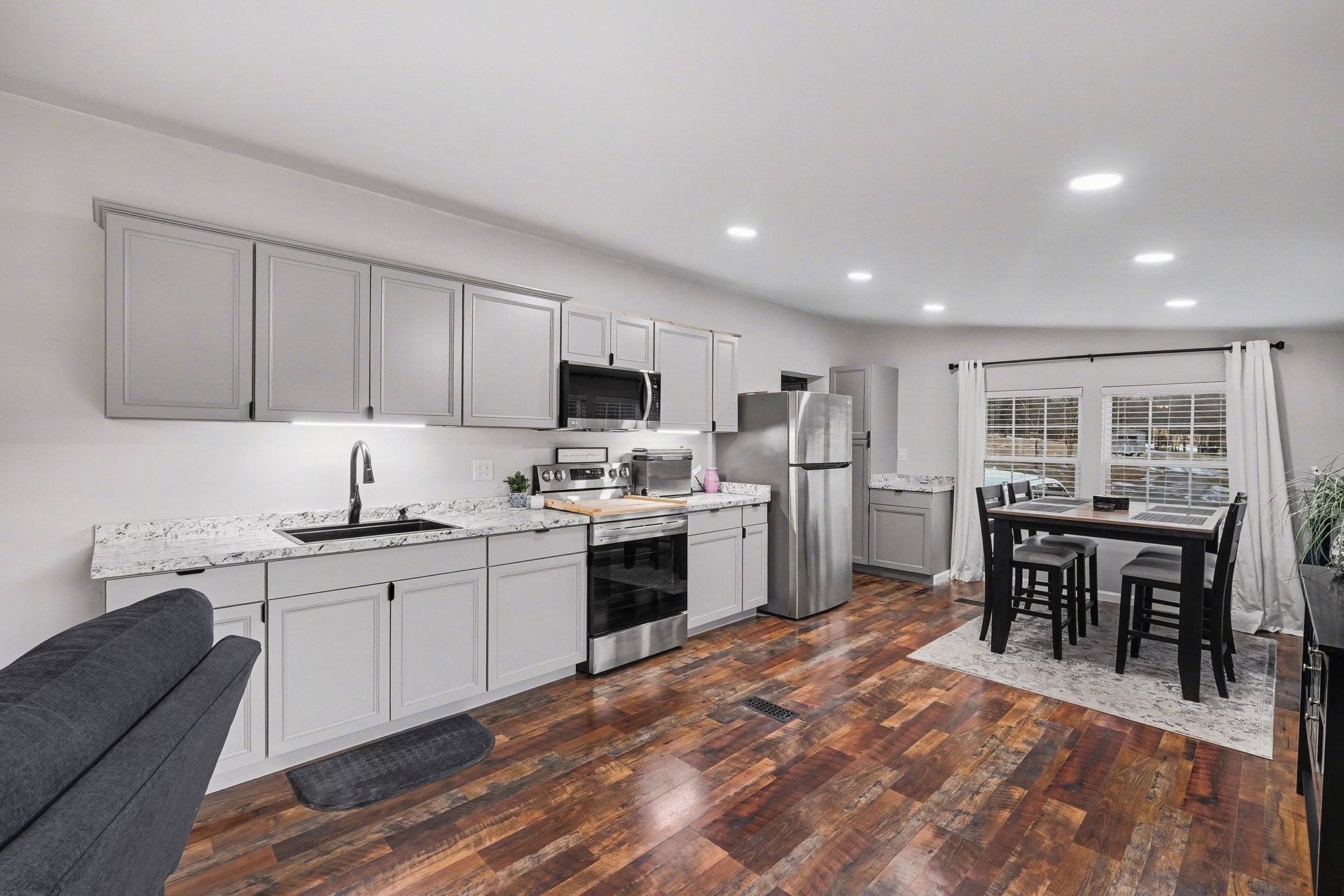 44 Opossum Hollow Road Gordonsville, TN 38563 - Photo 7 of 28 a kitchen with white cabinets and appliances