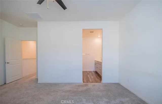 a white toilet sitting next to a white sink