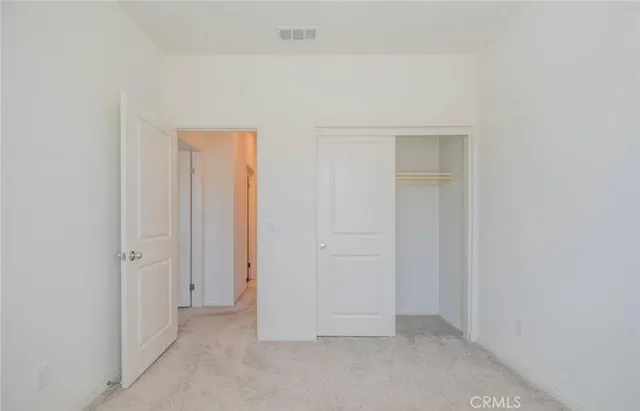 a bathroom with a sink a toilet a mirror a vanity and shower