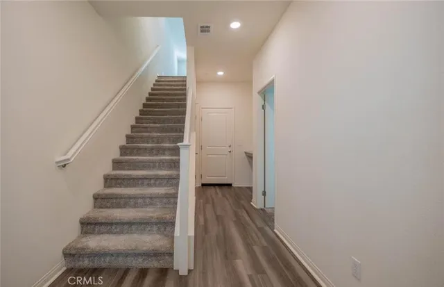 a view of entryway with wooden floor