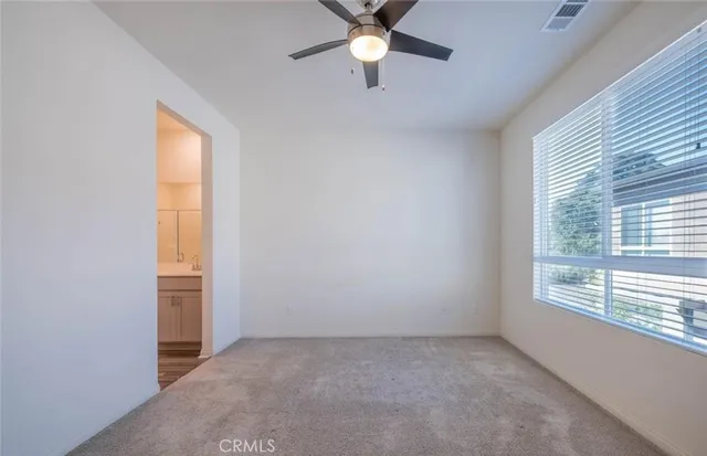 a view of a room that has a window in it