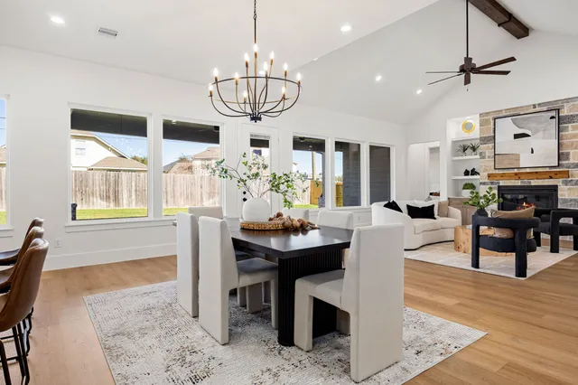 a view of kitchen space with wooden floor and electronic appliances