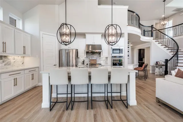 a view of dining area with furniture wooden floor a chandelier
