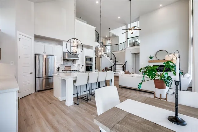 a view of kitchen with furniture and wooden floor