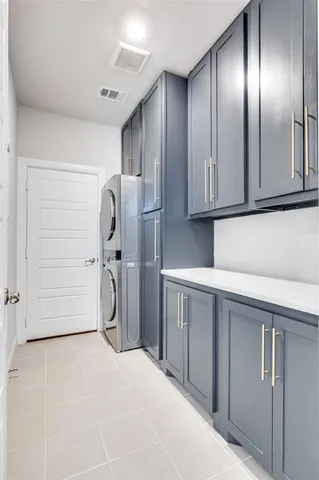 a view of a refrigerator in kitchen and cabinets