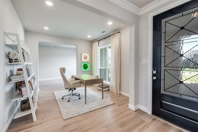 a living room with furniture a rug and a window