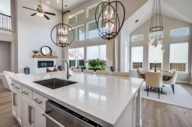 a large kitchen with a table and chairs