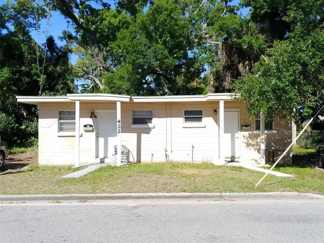 a view of a house with a street