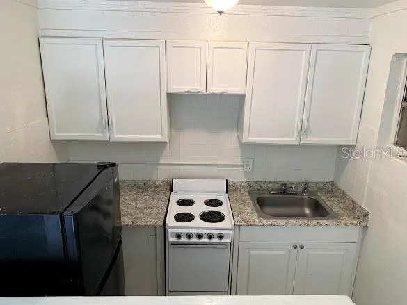 a kitchen with a stove and a microwave