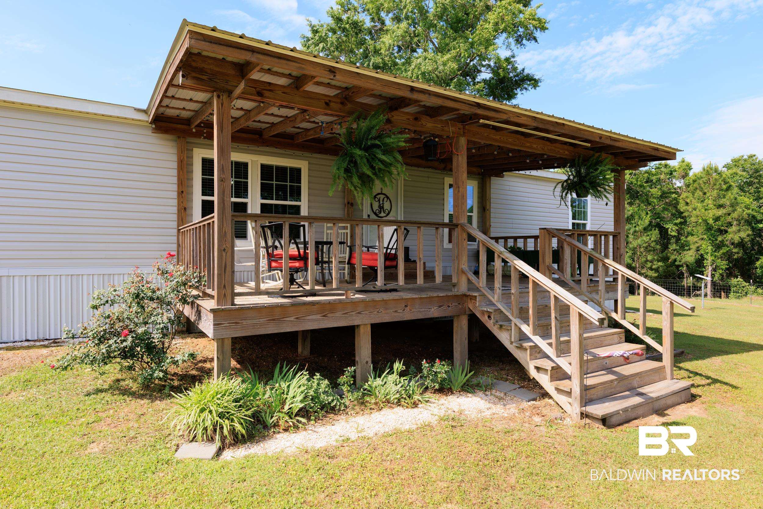 6725 Upper Creek Road Flomaton, AL 36441 - Photo 9 of 61 Back of house with a yard and a deck