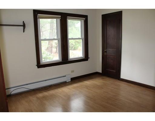 278 New Bedford Road Rochester, MA 02770 - Photo 16 of 23 a view of an empty room with wooden floor and a window