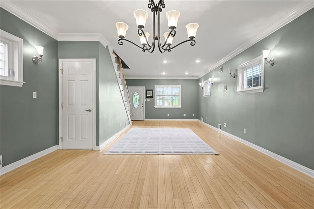 430 Hill Street Carnegie, PA 15106 - Photo 11 of 33 a view of an empty room with wooden floor