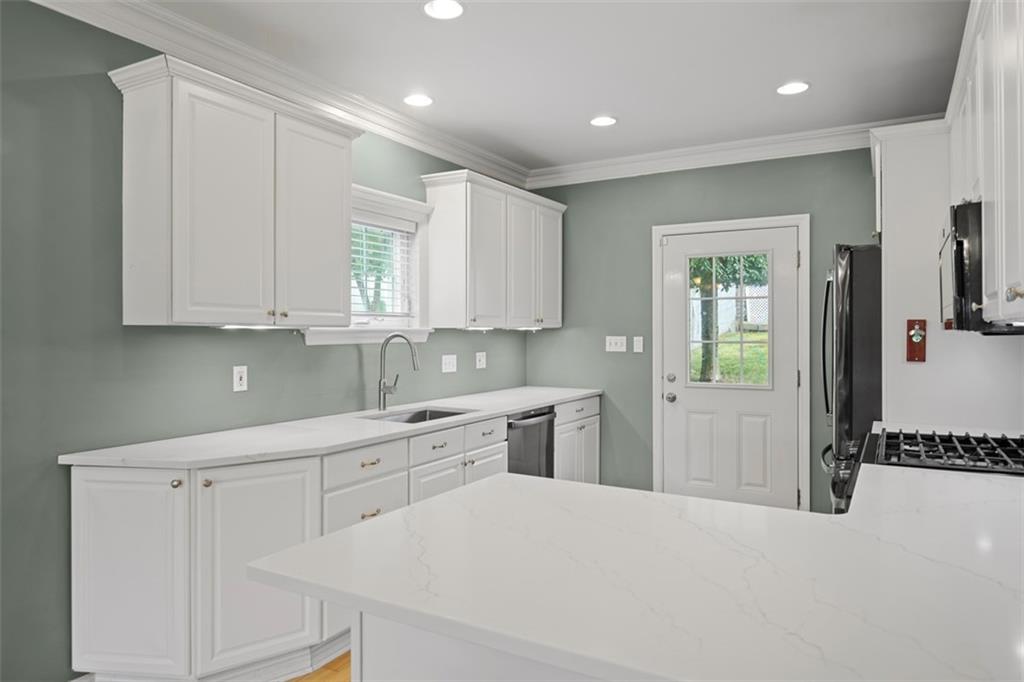 430 Hill Street Carnegie, PA 15106 - Photo 14 of 33 a kitchen with white cabinets and sink