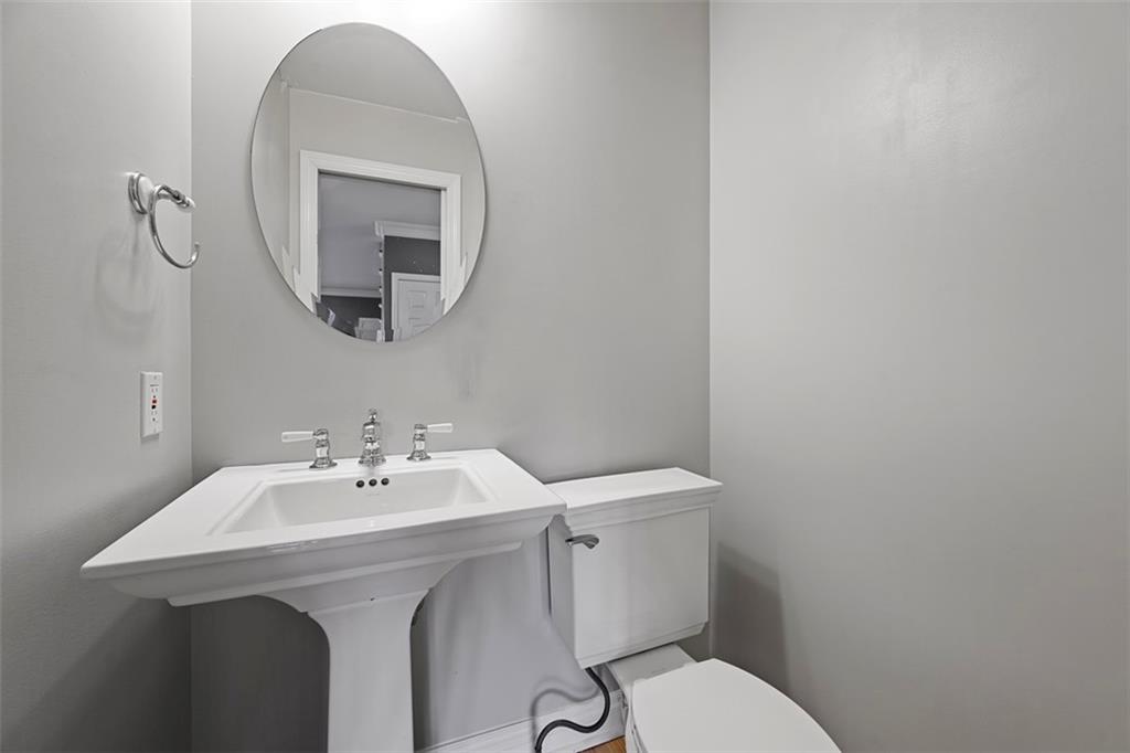 430 Hill Street Carnegie, PA 15106 - Photo 17 of 33 a bathroom with a sink mirror and toilet