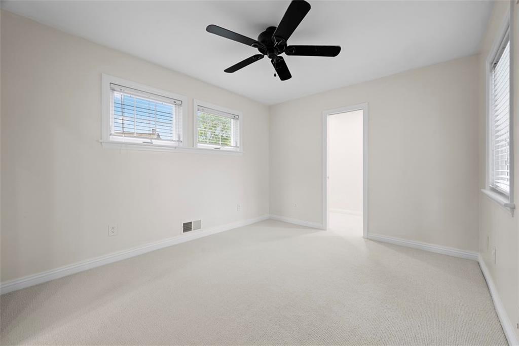 430 Hill Street Carnegie, PA 15106 - Photo 25 of 33 an empty room with a window and a fan