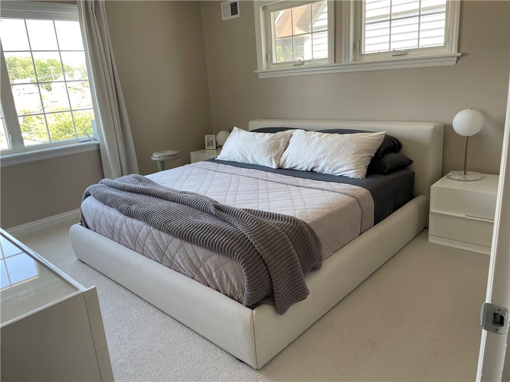 430 Hill Street Carnegie, PA 15106 - Photo 27 of 33 a bed sitting in a bedroom next to a window