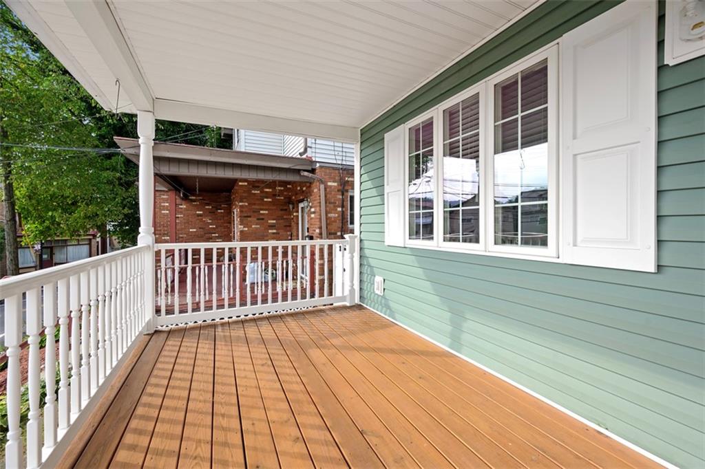 430 Hill Street Carnegie, PA 15106 - Photo 3 of 33 a view of a brick house with wooden floor and wooden fence