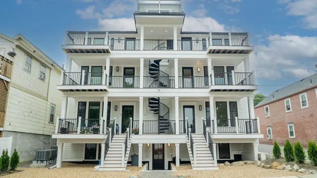a front view of a building with a lot of windows