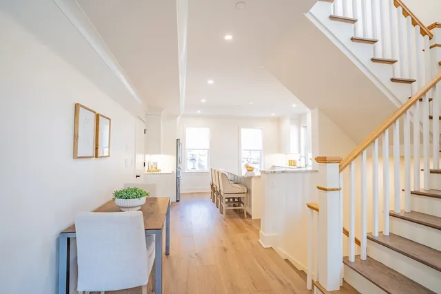 a bathroom with a sink mirror and a bathtub