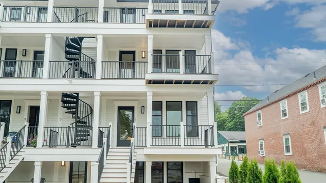 a balcony with trees in front of it