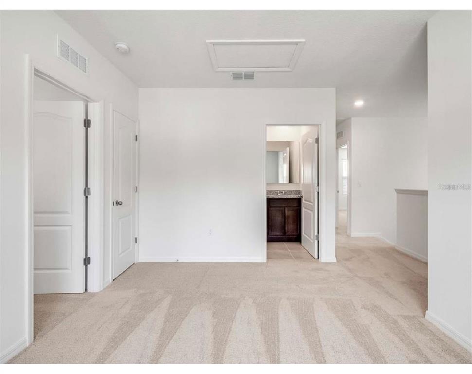 3993 Rory Oak Circle Apopka, FL 32703 - Photo 12 of 19 a view of an empty room with wooden cabinet