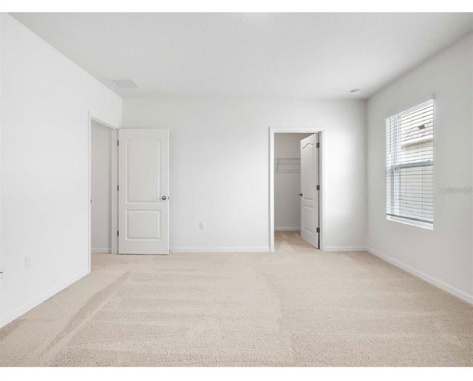 3993 Rory Oak Circle Apopka, FL 32703 - Photo 13 of 19 a view of an empty room with a window