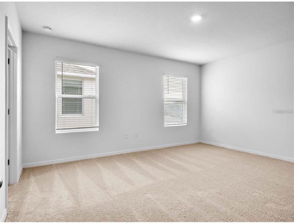 3993 Rory Oak Circle Apopka, FL 32703 - Photo 14 of 19 an empty room with windows