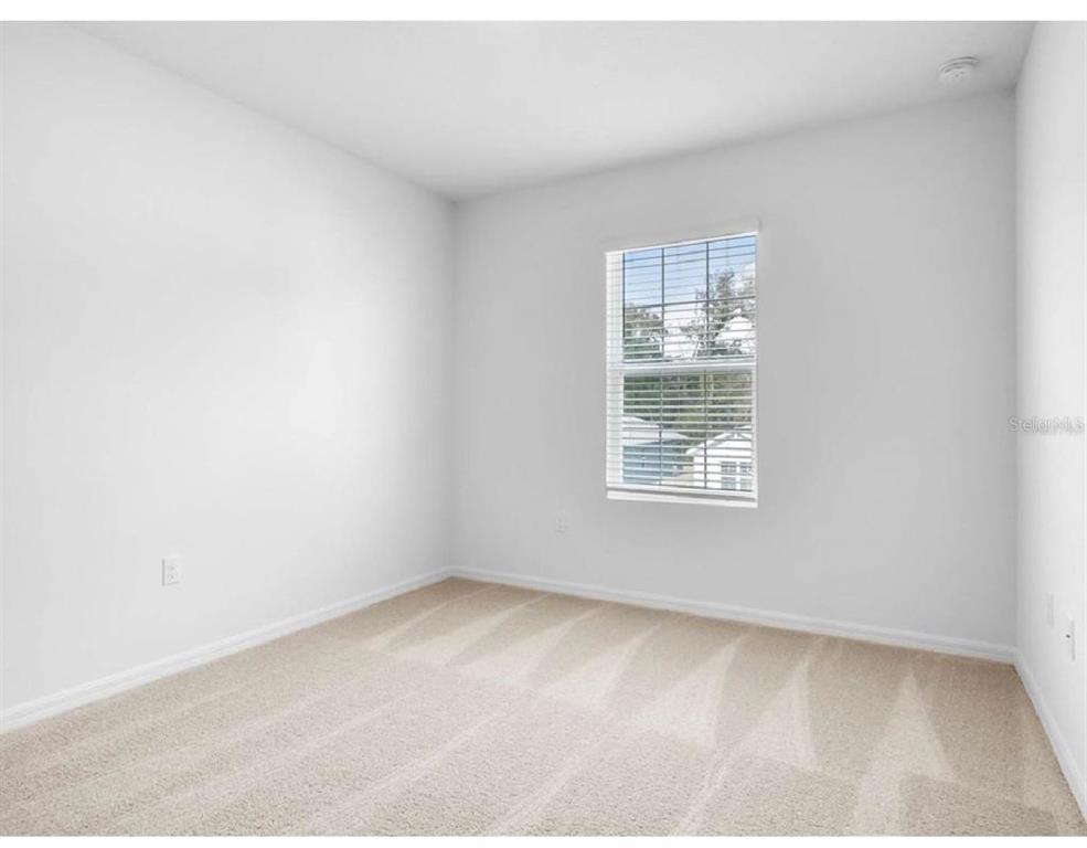 3993 Rory Oak Circle Apopka, FL 32703 - Photo 17 of 19 a view of an empty room with a window