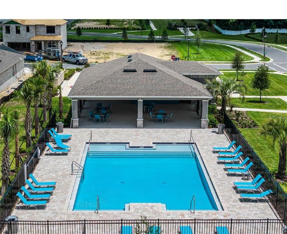3993 Rory Oak Circle Apopka, FL 32703 - Photo 18 of 19 a view of swimming pool with seating area and yard