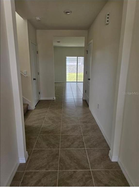 3993 Rory Oak Circle Apopka, FL 32703 - Photo 3 of 19 a view of hallway with window