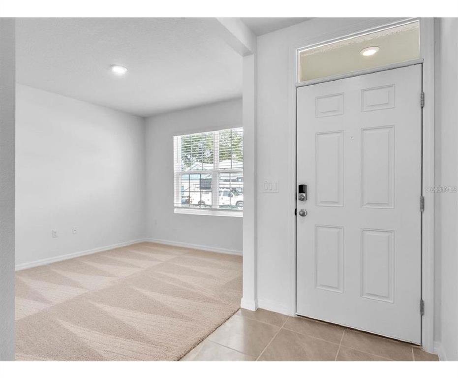 3993 Rory Oak Circle Apopka, FL 32703 - Photo 8 of 19 an empty room with windows and closet