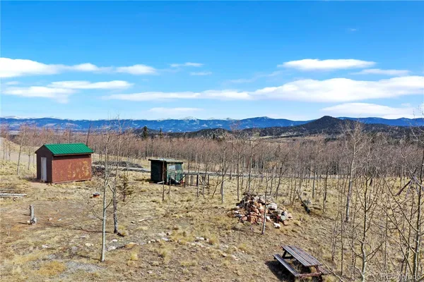 a view of a house with a mountain in the background