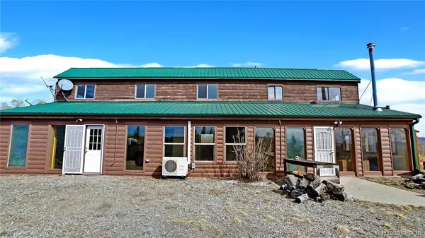 a front view of a building with glass windows and table