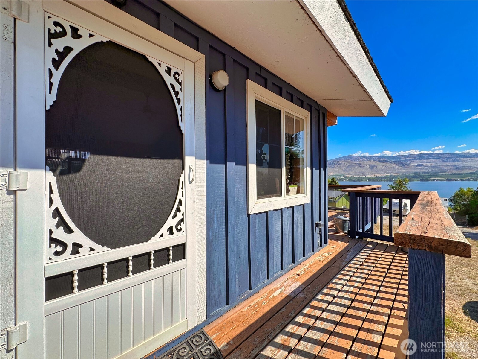 a view of balcony with wooden floor