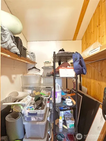 a room with furniture and a potted plant